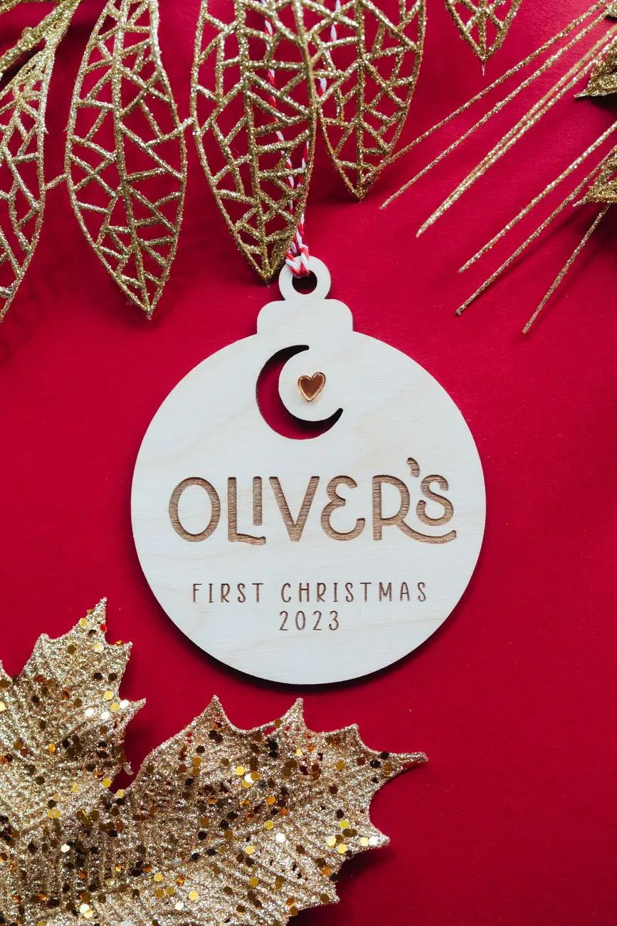 Baby's First Christmas Moon & Star Bauble hanging on a Christmas tree