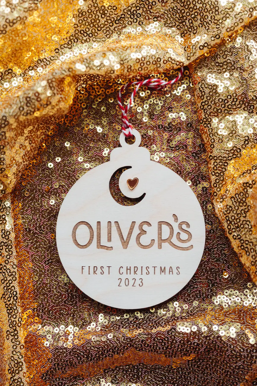 Laser-engraved wooden baby's first christmas moon & star bauble with ribbon