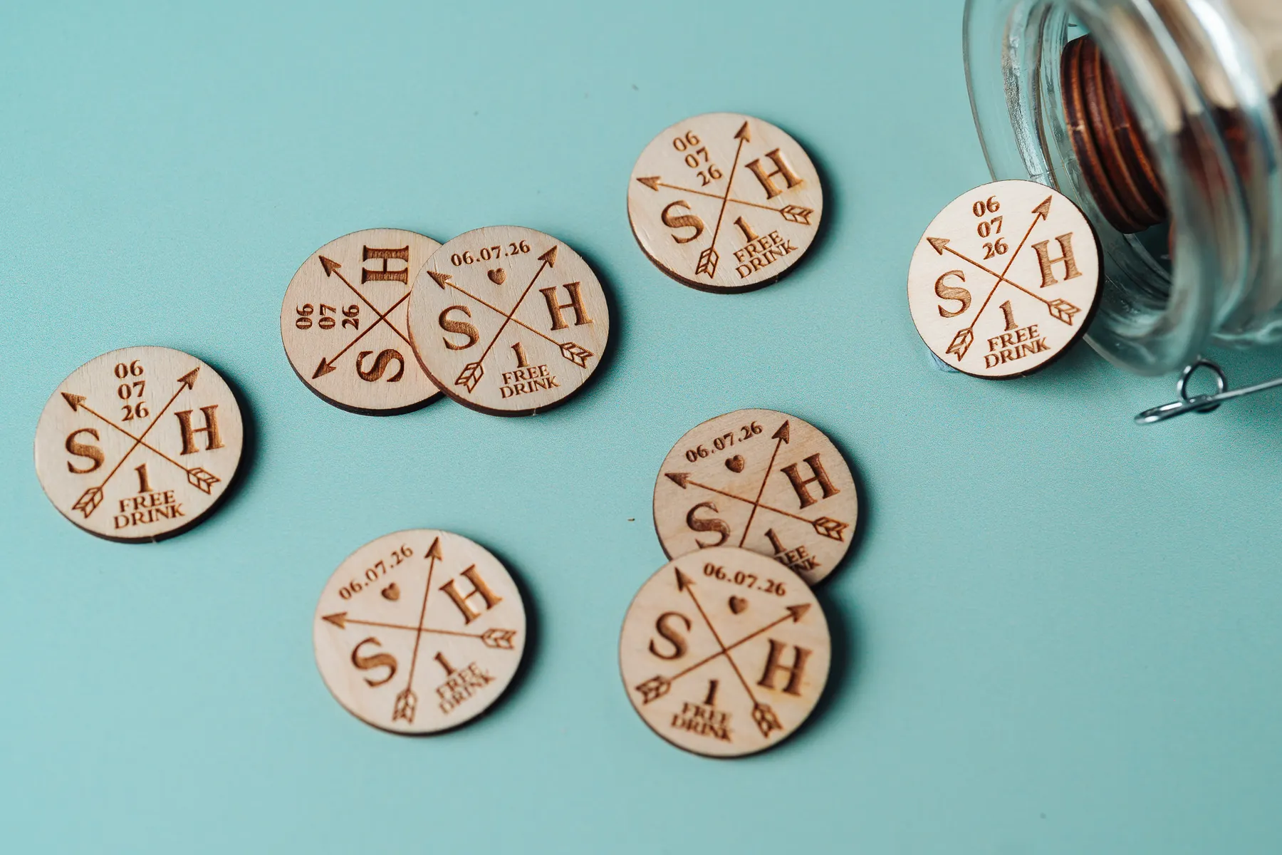 Personalised arrow design drink tokens engraved on birch plywood