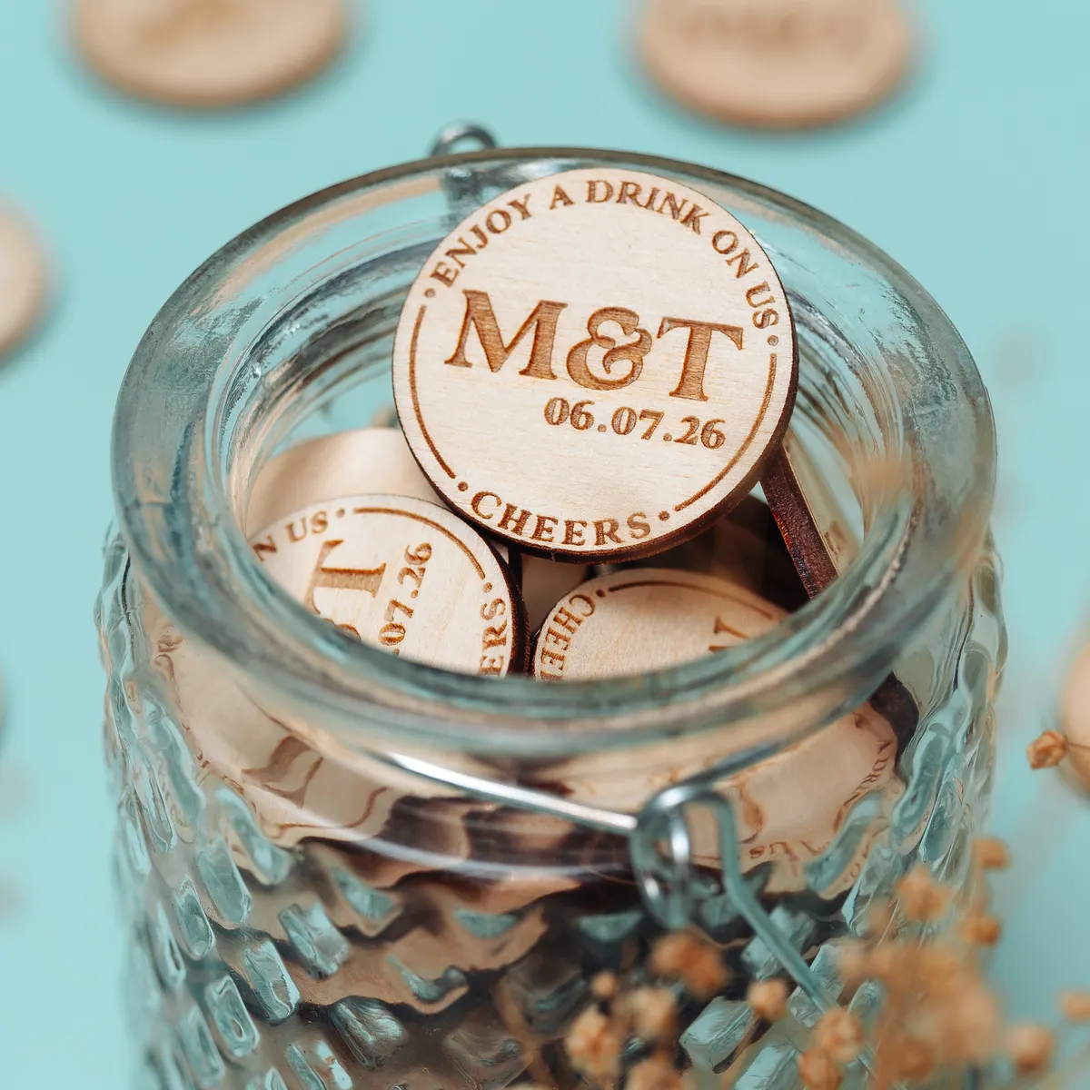 Personalised boho wooden wedding drink token with engraved wildflower design made in Norwich UK