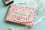 confetti hearts wedding guest book open showing thick 160gsm white pages for guest messages