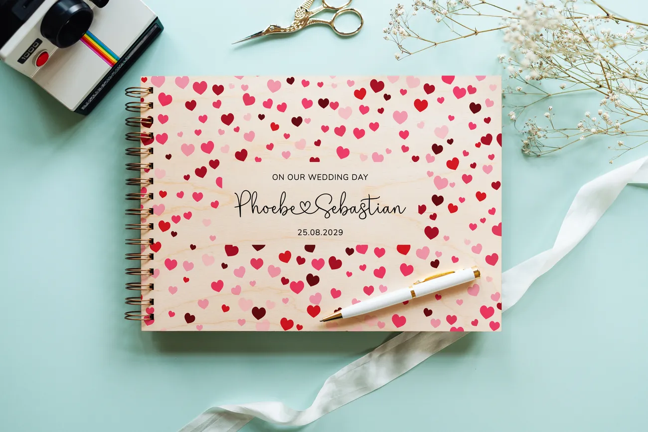 personalised wooden wedding guest book lying flat showing landscape format and copper spiral wire binding