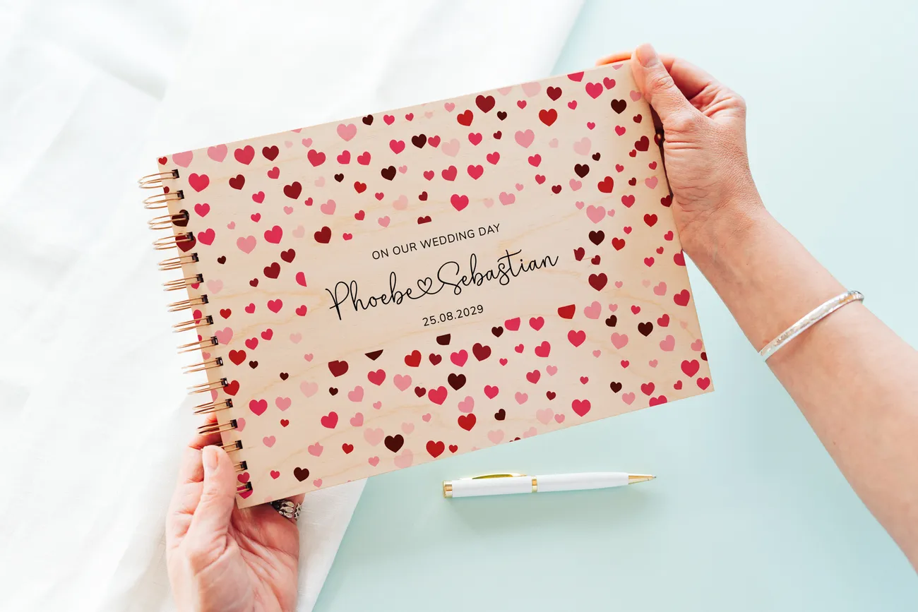 personalised confetti hearts wedding guest book cover detail with laser-engraved floral design