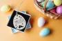 Close-up of the egg hunt easter basket tag engraving
