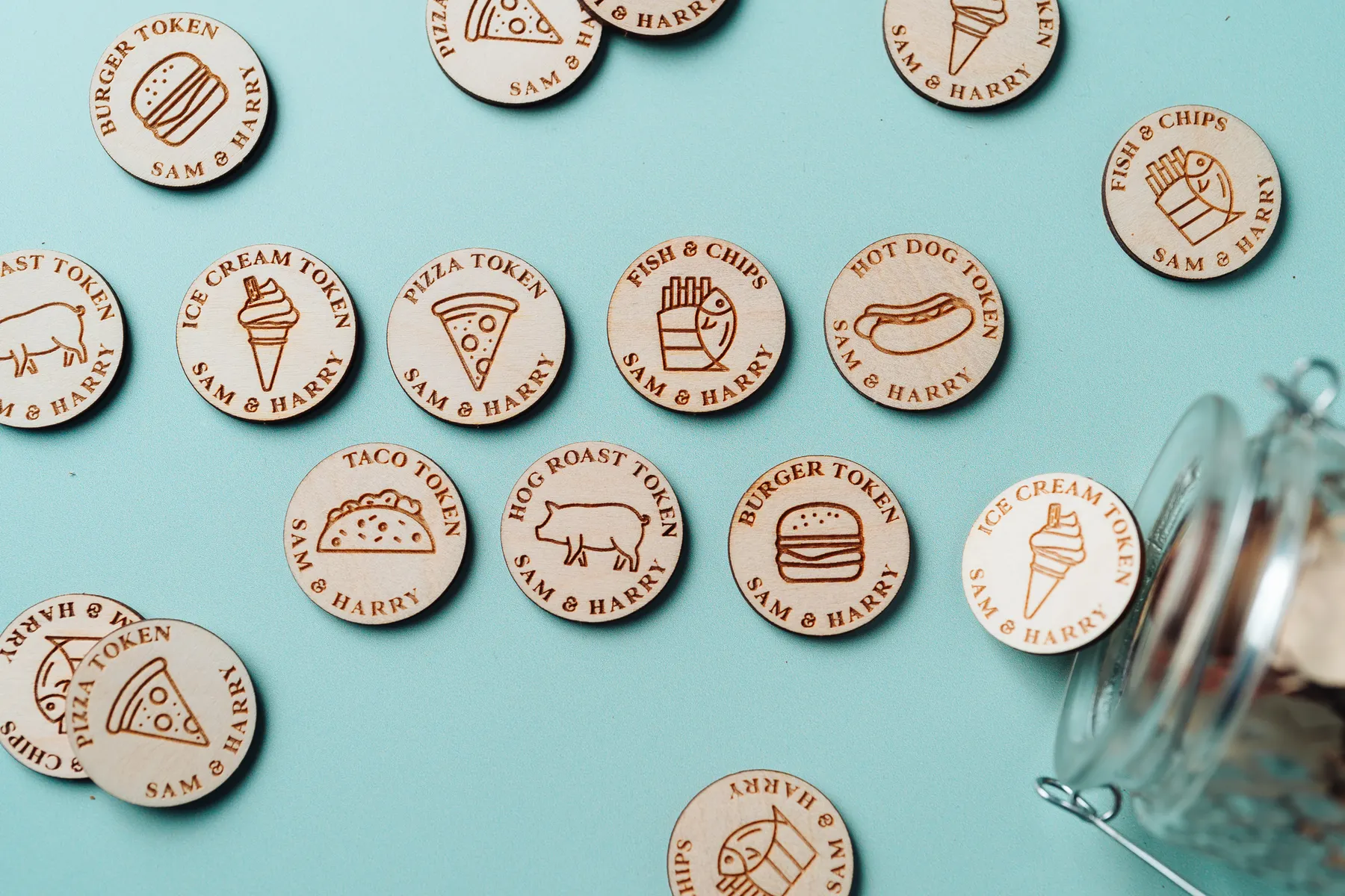 Personalised Food Tokens displayed on a rustic wooden surface