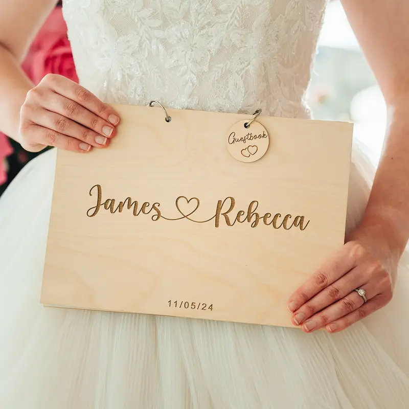 Love Heart Wedding Guest Book open with handwritten guest messages