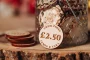 Cash Value Drink Tokens displayed on a rustic wooden surface