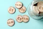 Cash Value Drink Tokens held in hand showing engraved detail