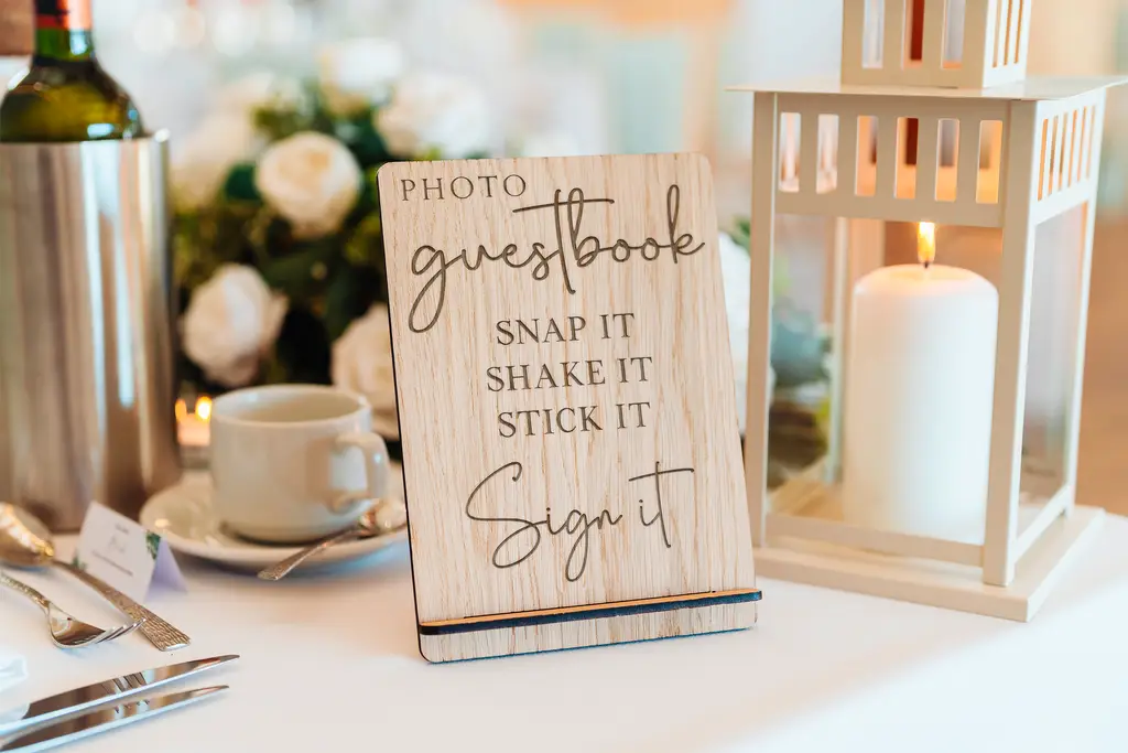Snap it Shake it Stick it Sign it propped upright showing the full design