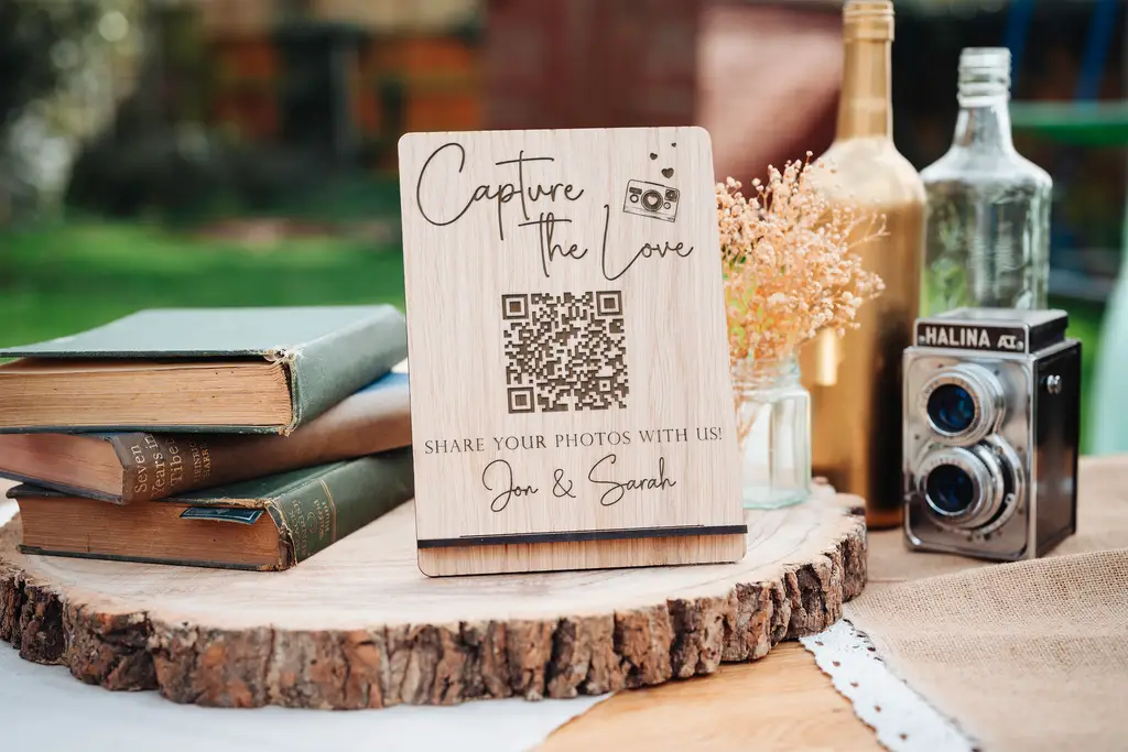 Laser-engraved oak capture the love qr code sign with natural wood grain