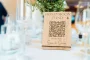 Laser-engraved oak honeymoon fund qr code sign with natural wood grain