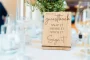 Snap it Shake it Stick it Sign it displayed on an easel at a wedding reception