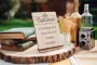 Cupcake Wedding Menu Sign displayed on an easel at a wedding reception