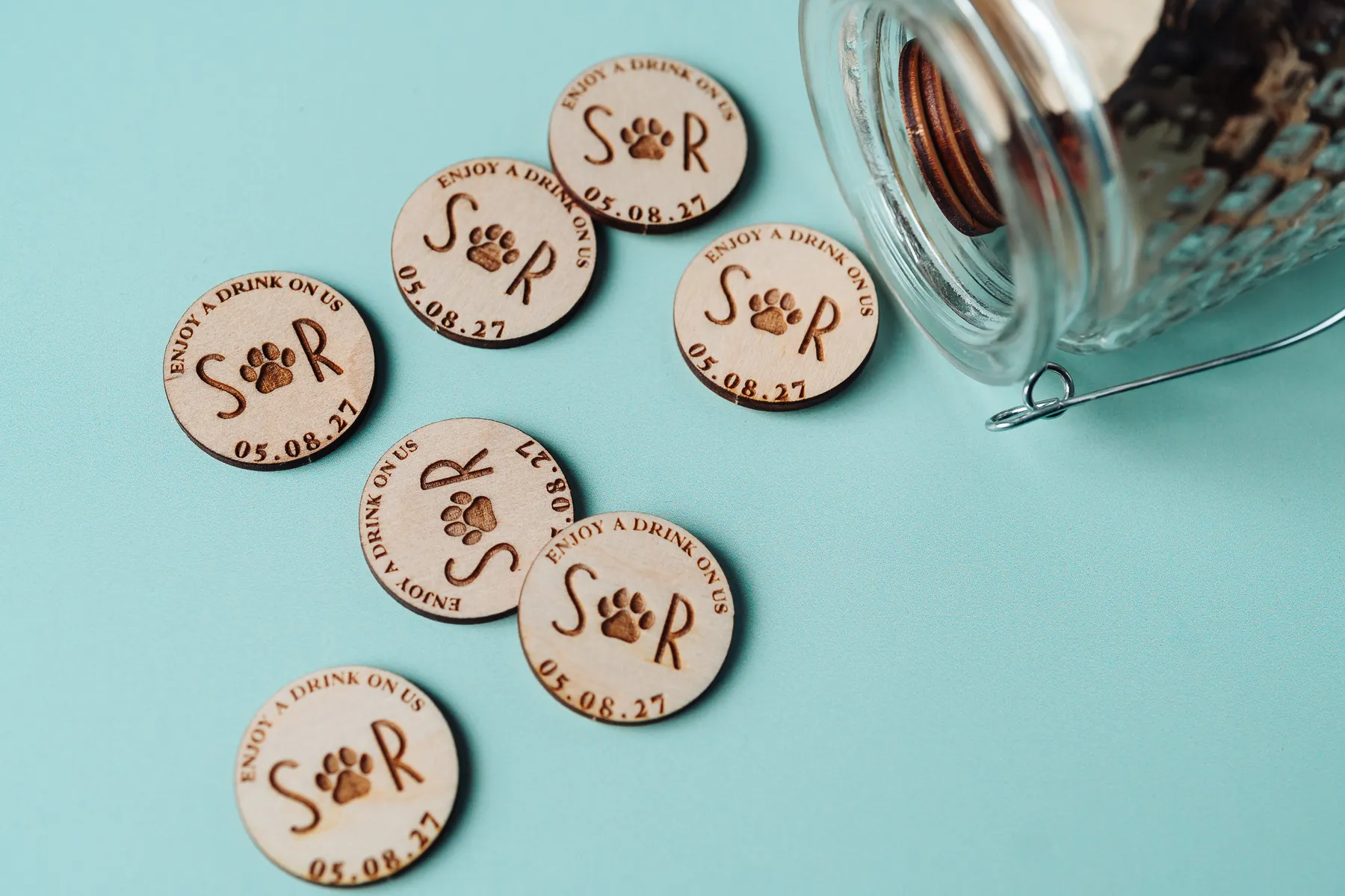 Paw-Tokens-2.webp Personalised paw print drink tokens engraved on birch plywood
