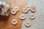 Paw Print Drink Tokens 3 Close-up of personalised paw print wooden wedding drink token with engraved dog paw detail