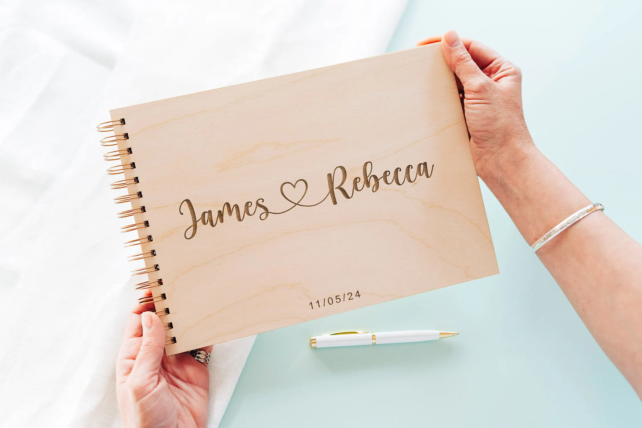Boho Love Heart Wedding Guest Book open showing the lined interior pages