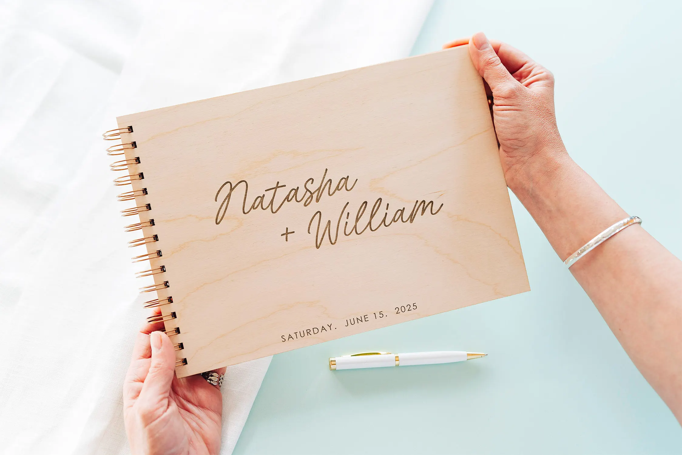 Spiral-Guestbooks-153.webp Close-up of the modern spiral-bound wedding guest book engraved cover detail