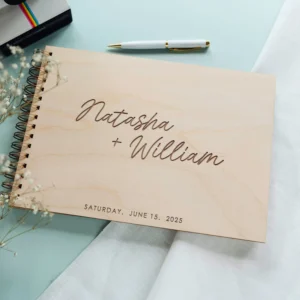 Personalised spiral-bound wedding guest book with wildflower engraving handcrafted by CluckingBelle Designs