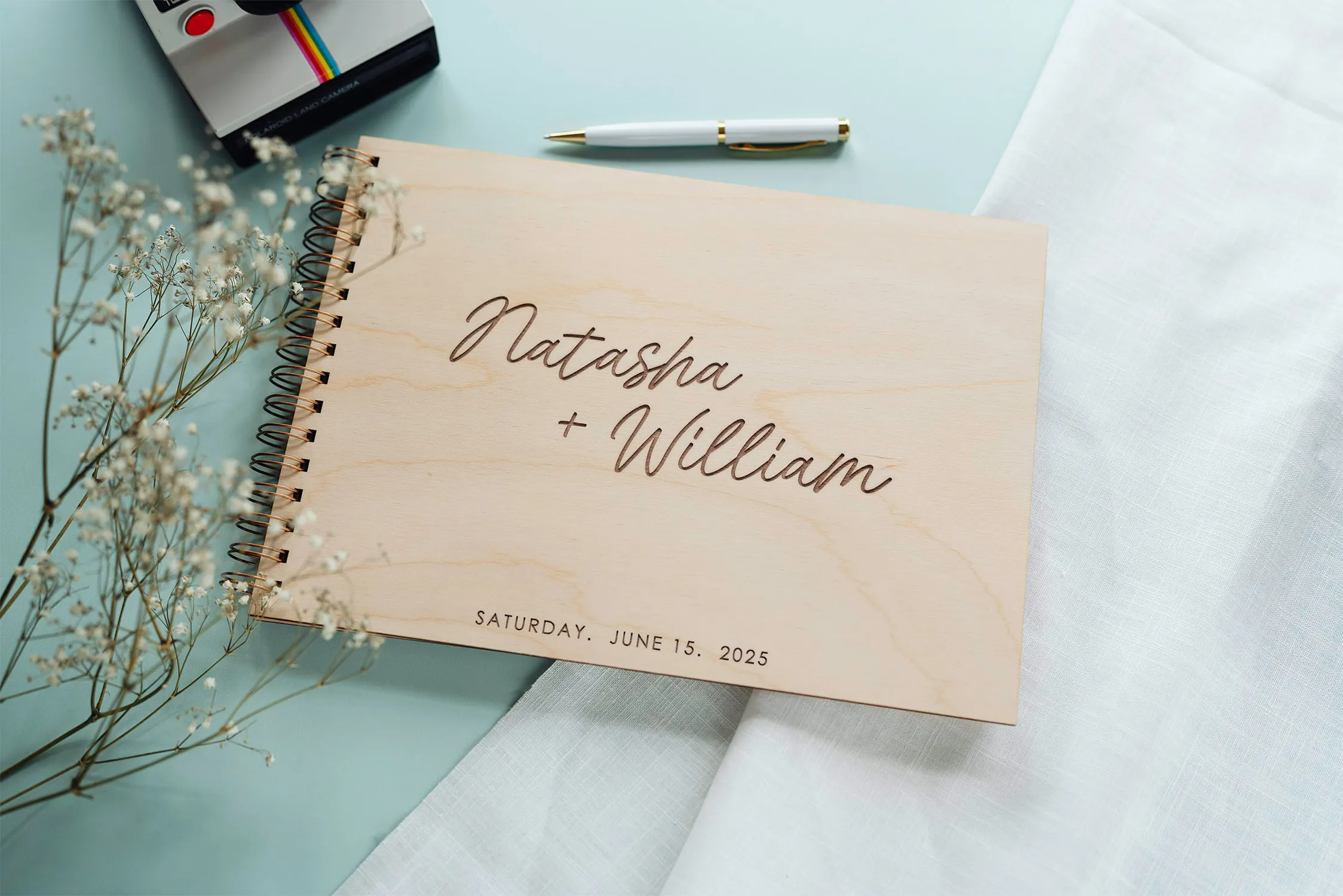 Spiral-Guestbooks-44.webp Personalised spiral-bound wedding guest book with wildflower engraving handcrafted by CluckingBelle Designs