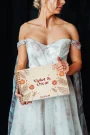 personalised wooden wedding guest book lying flat showing landscape format and copper spiral wire binding