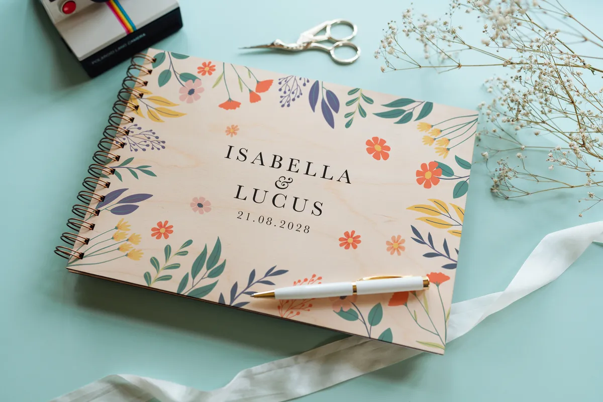 Bold botanical wedding guest book showing A4 and A5 size options side by side with spiral wire binding