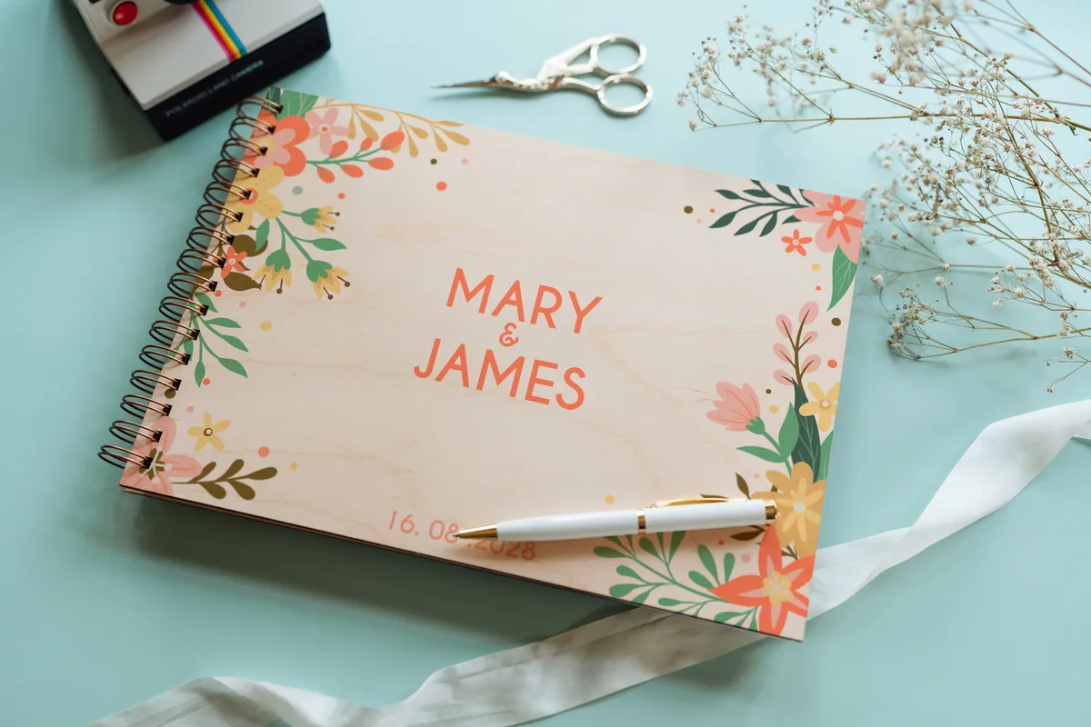 open personalised wooden wedding guest book with handwritten guest messages on white pages