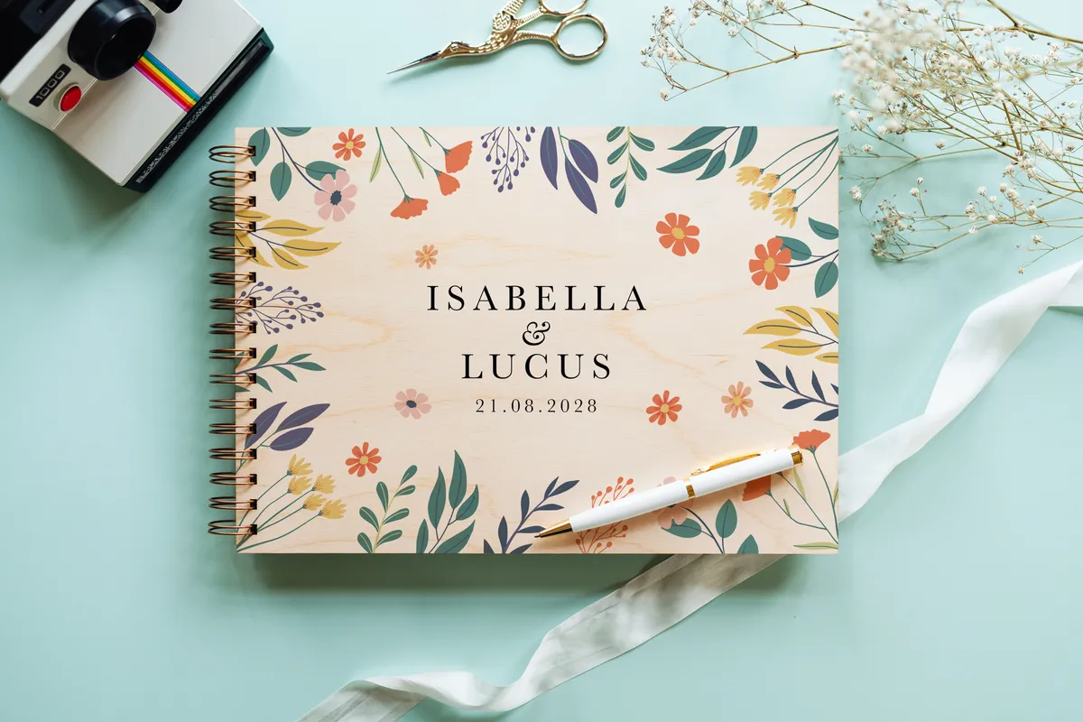 Bold botanical wedding guest book landscape view showing full-colour printed wooden cover and spiral wire binding