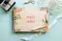 floral engraved wedding guest book open showing thick 160gsm white pages for guest messages
