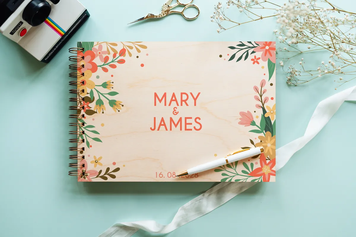 floral engraved wedding guest book open showing thick 160gsm white pages for guest messages