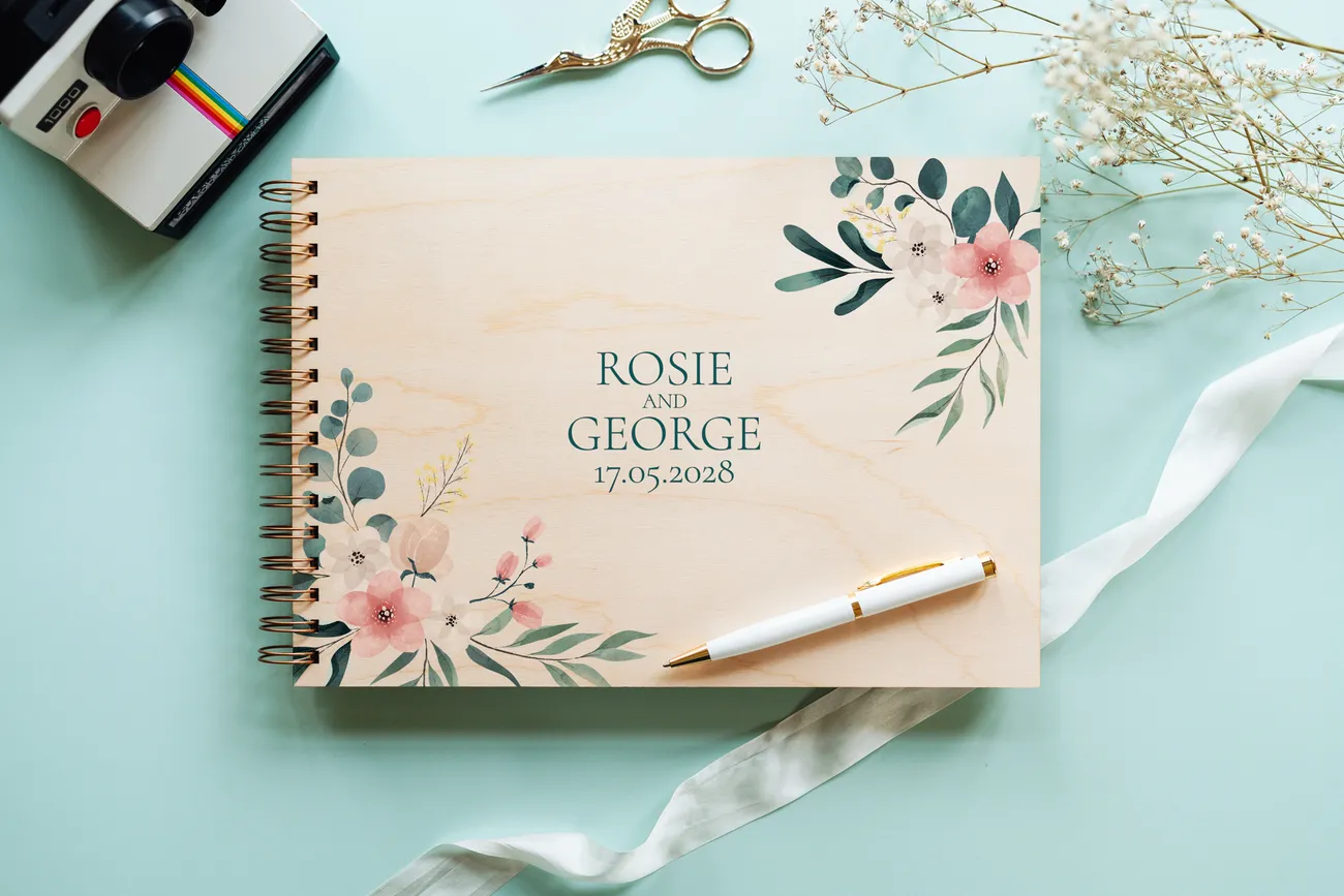 floral engraved personalised wooden wedding guest book with spiral wire binding and personalised wooden cover