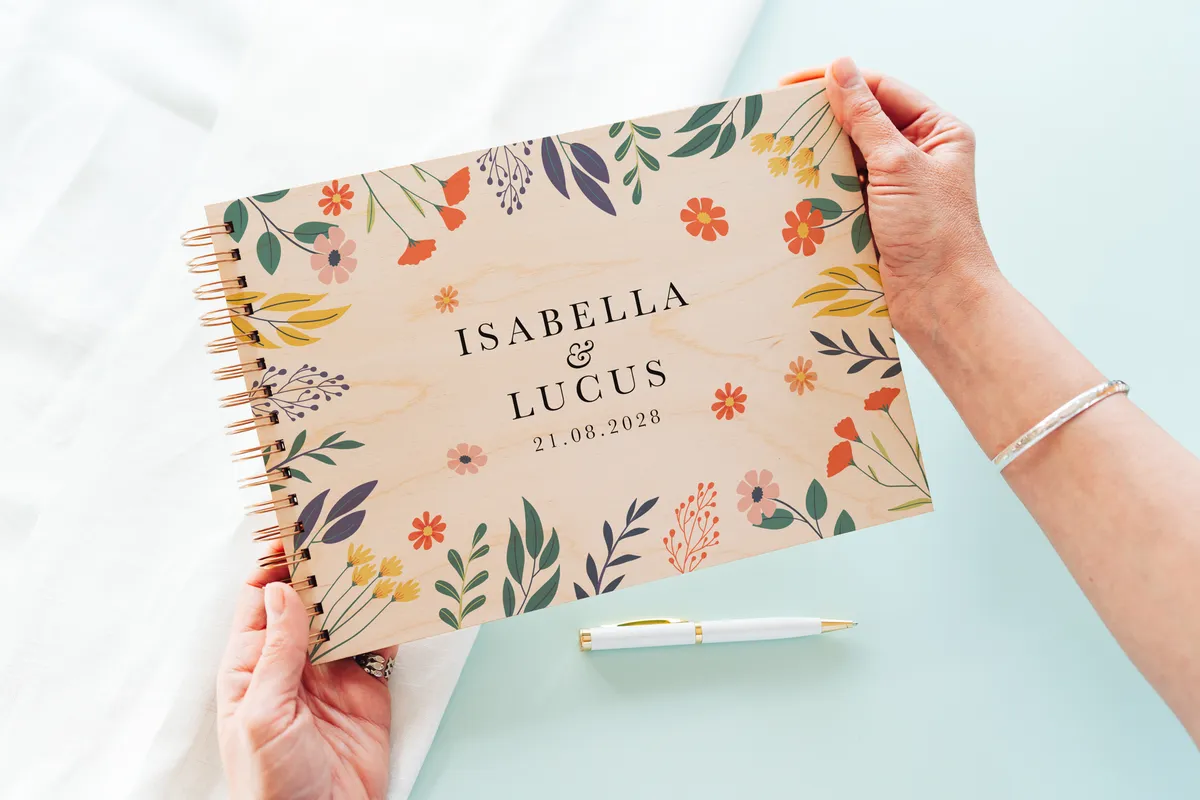 Bold botanical wooden wedding guest book internal page layout showing lined pages for guest messages