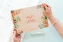 floral engraved wedding guest book cover with personalised couple names and wedding date