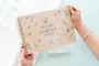 engraved wedding guest book open showing thick 160gsm white pages for guest messages