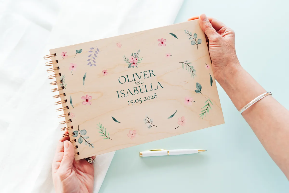 engraved wedding guest book open showing thick 160gsm white pages for guest messages