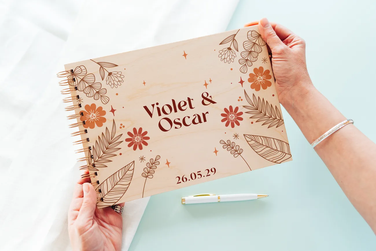 autumn boho personalised wooden wedding guest book with spiral wire binding and personalised wooden cover