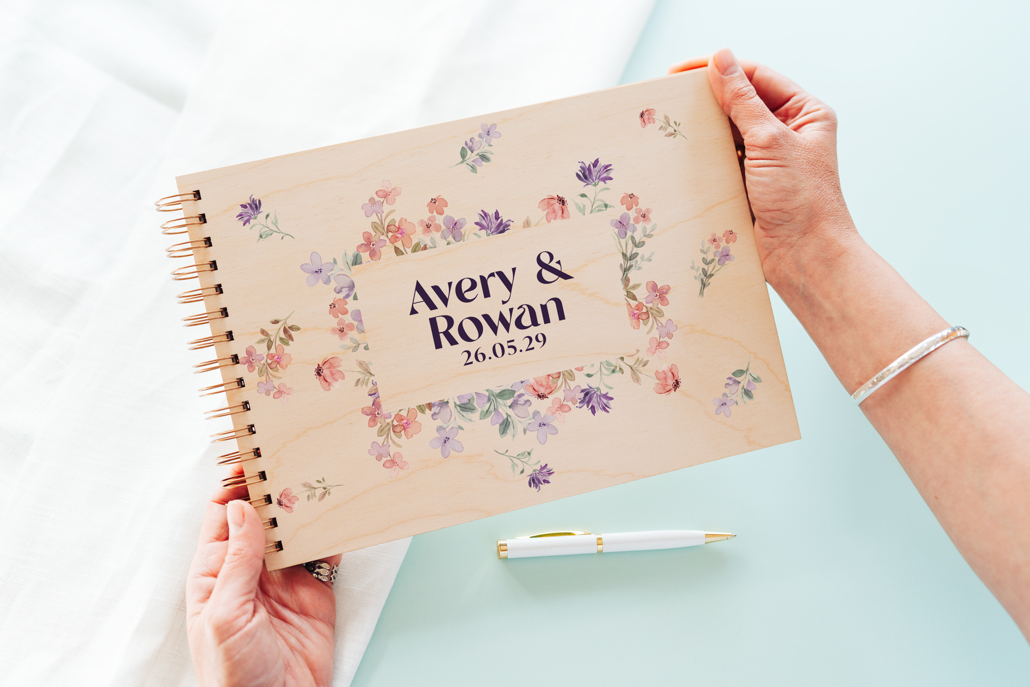 Wildflower border wedding guest book internal lined pages shown open with spiral wire binding detail