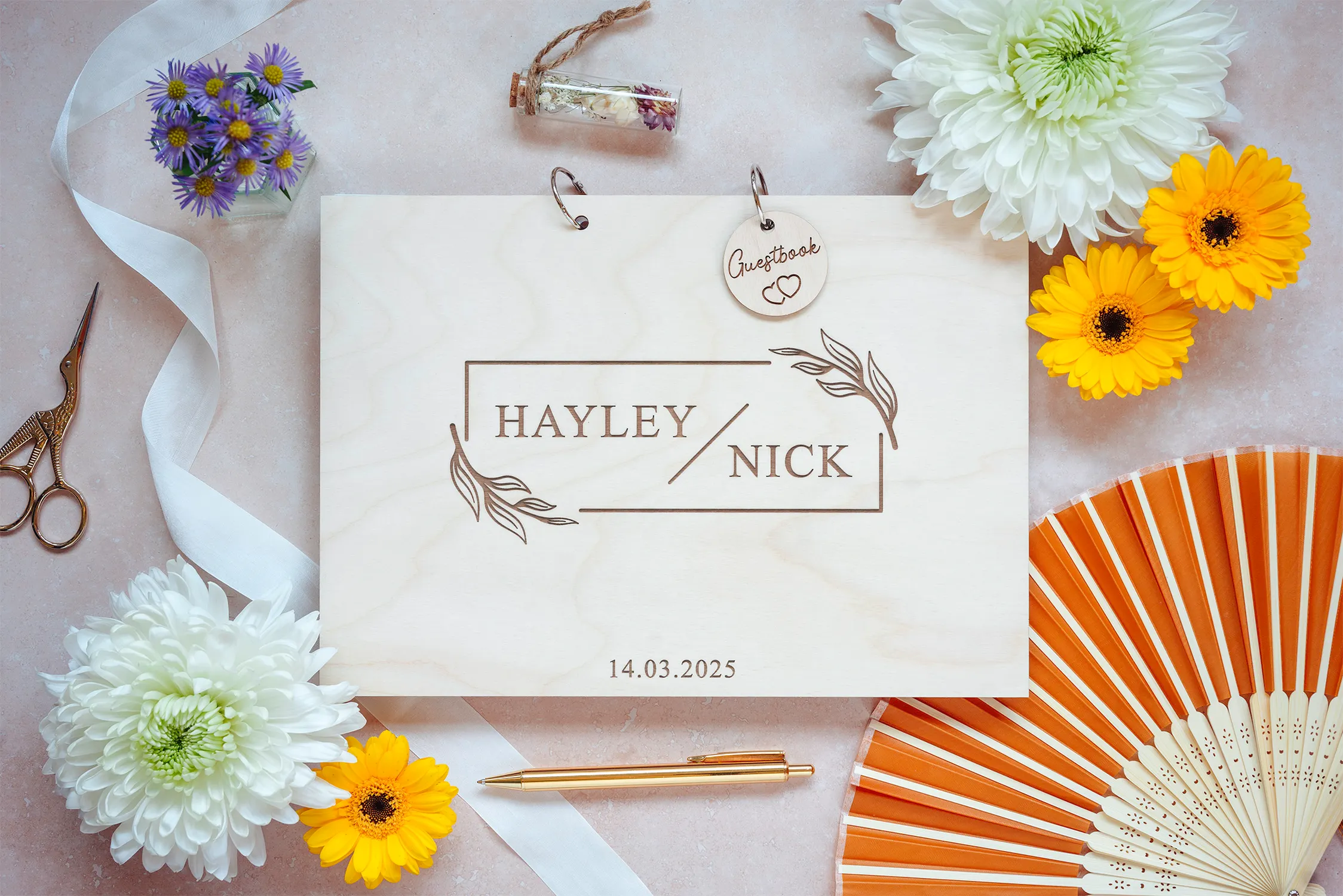 Close-up of the floral wedding guest book engraved cover detail