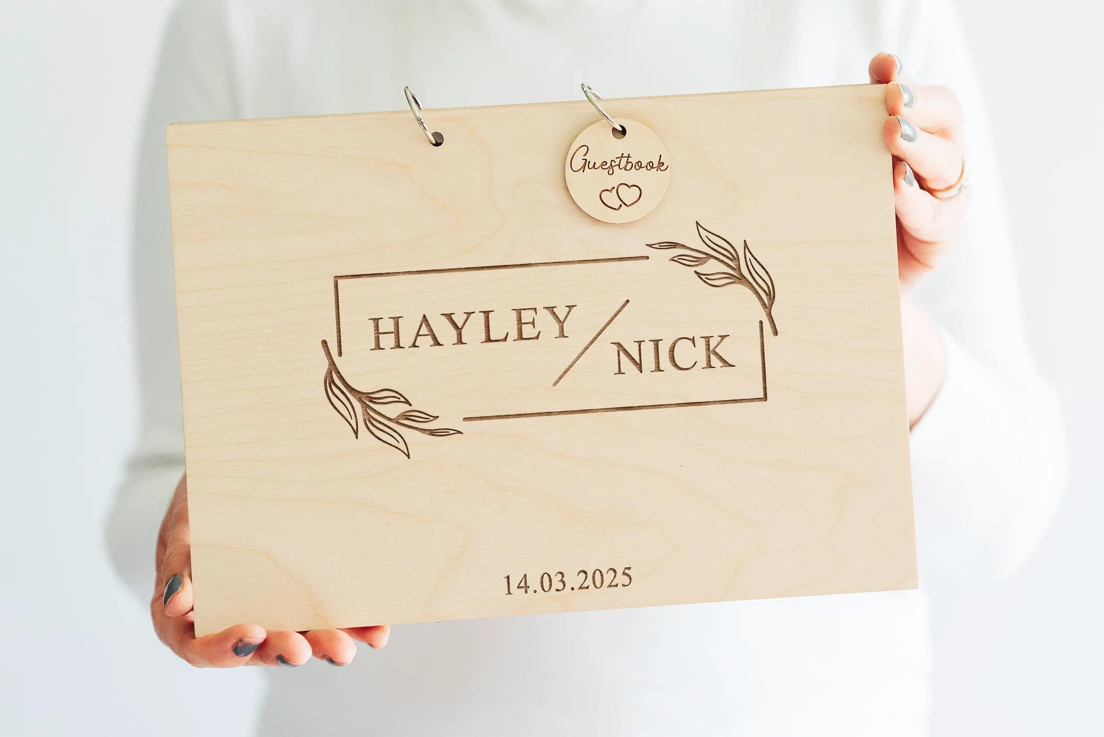 Personalised floral wedding guest book with couple's names and date