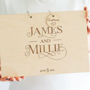 Personalised wooden wedding guest book open showing handwritten messages from wedding guests