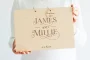 Personalised wooden wedding guest book open showing handwritten messages from wedding guests