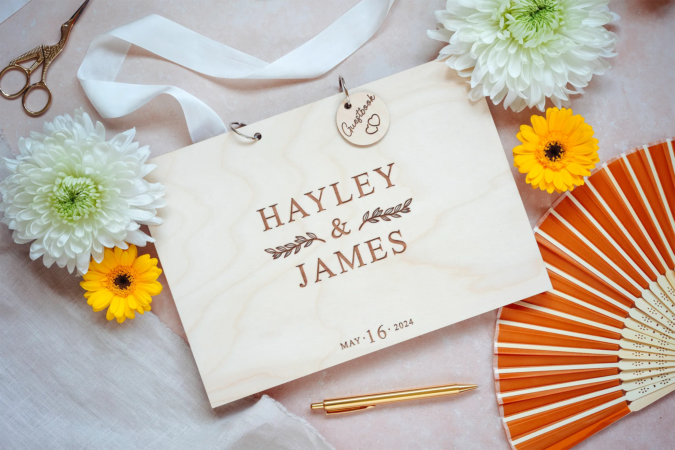 Laser-engraved wooden cover of the contemporary minimal wedding guest book