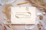 Laser-engraved wooden cover of the floral wedding guest book