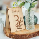 personalised wooden CluckingBelle Designs product — wildflower engraved oak place numbers