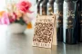 capture the love QR code engraved wooden sign propped upright on a reception table