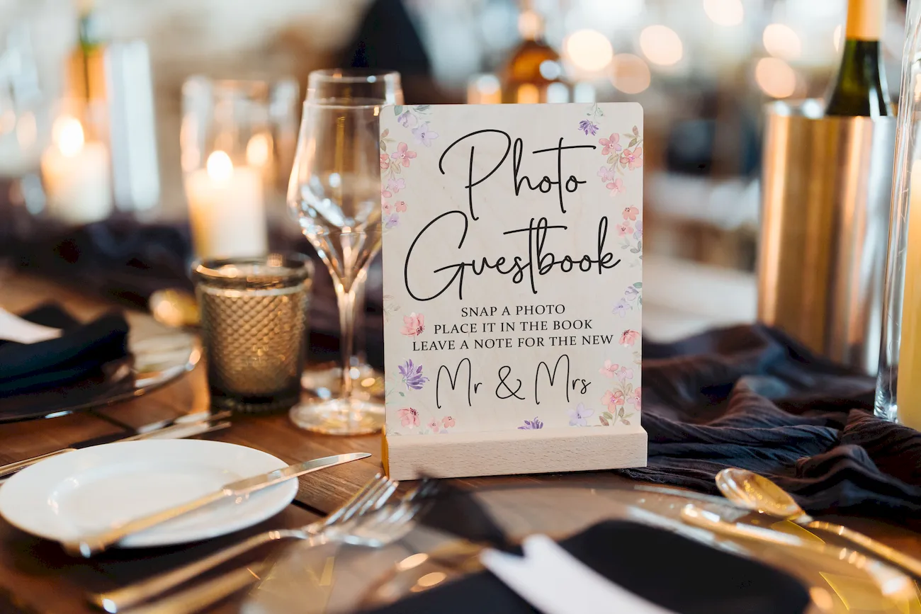 wildflower engraved wedding guest book cover with personalised couple names and wedding date