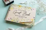 Yellow wildflower wedding guest book square cover close-up showing vibrant colour-printed floral wooden cover